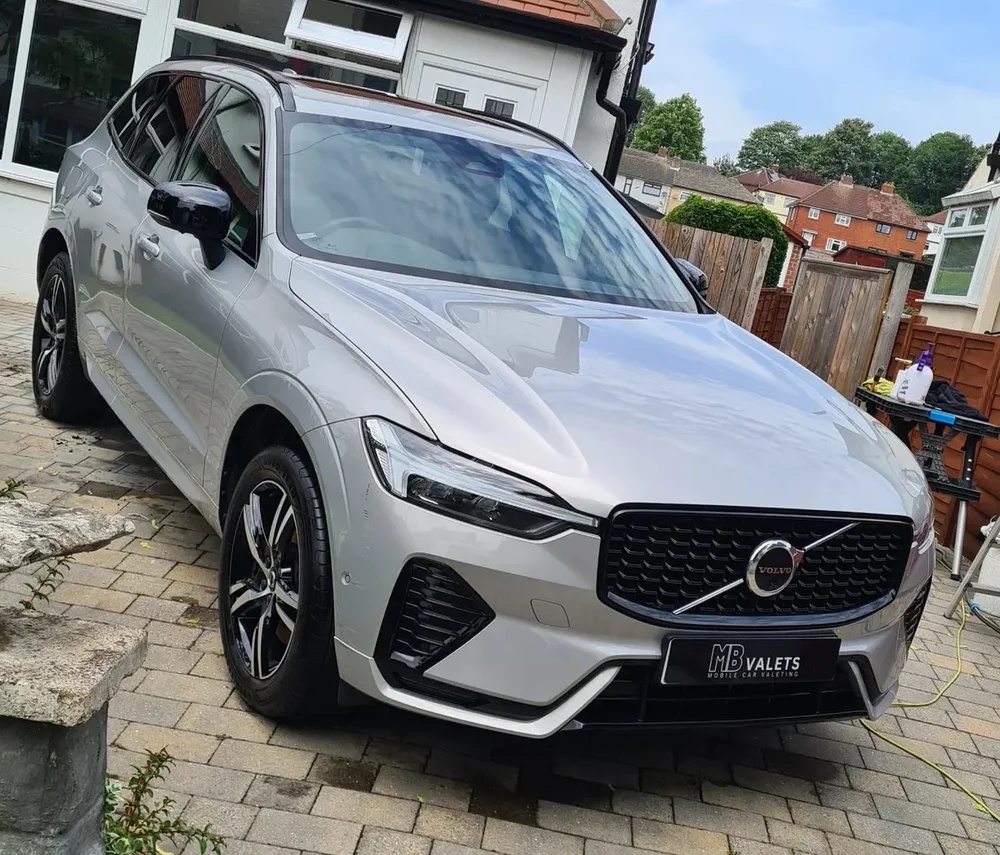 A finished silver Volvo wearing an MB Valets number plate cover