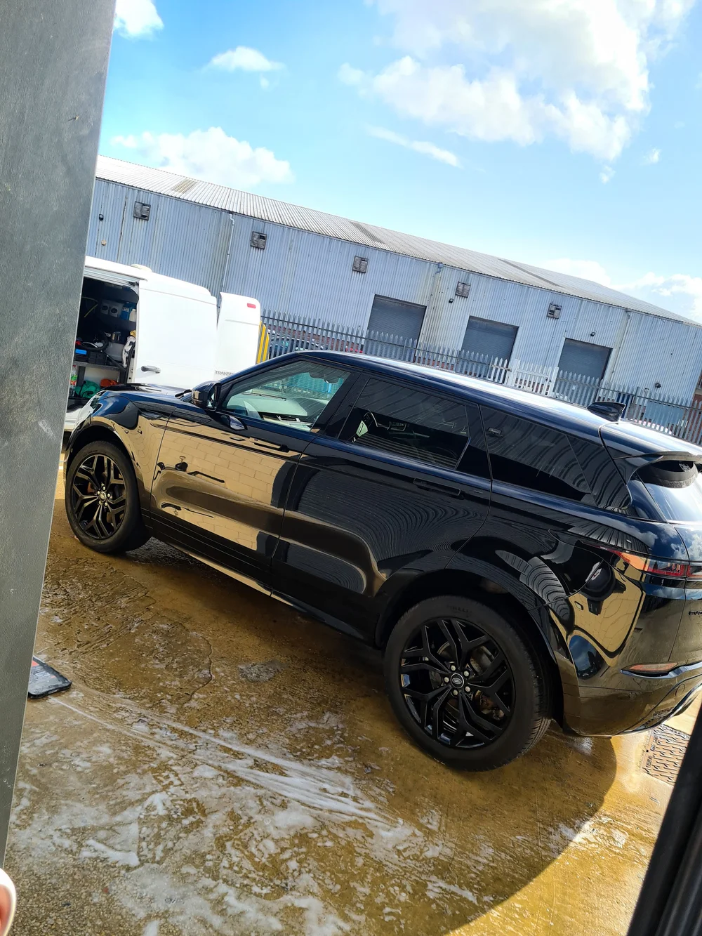 Freshly cleaned black Range Rover photographed outside